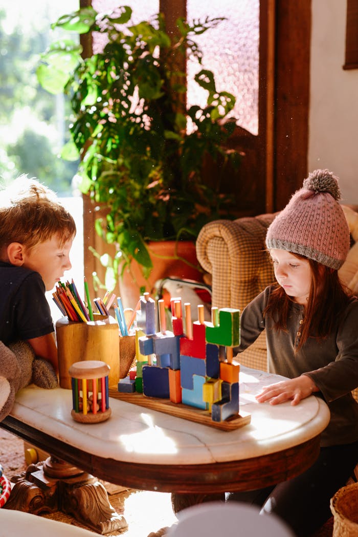 Children Playing with Blocks on a Table